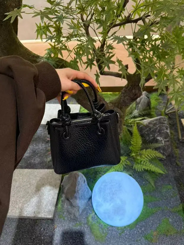 An image of a  Black TF5809 Mini Handbag by  Mirra Masa