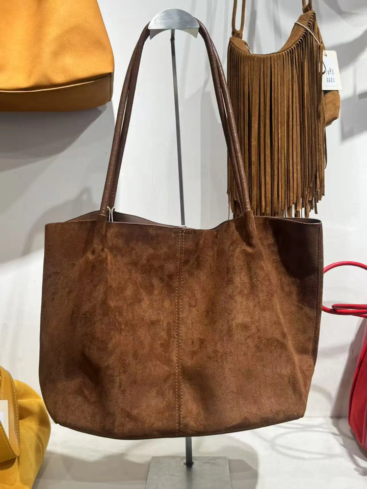 An image of a   TF7016 Suede Tote Bag by  Mirra Masa