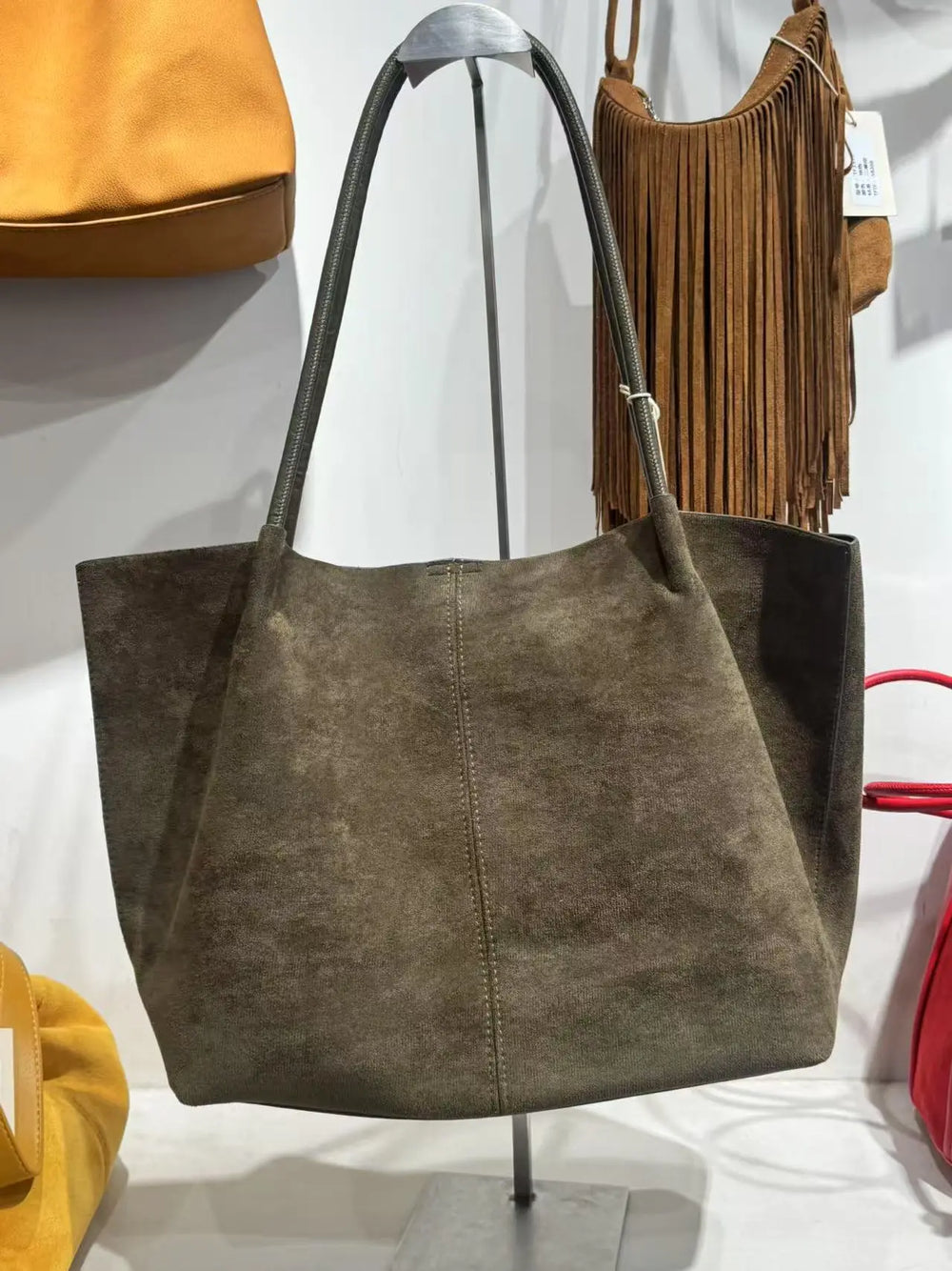An image of a   TF7016 Suede Tote Bag by  Mirra Masa