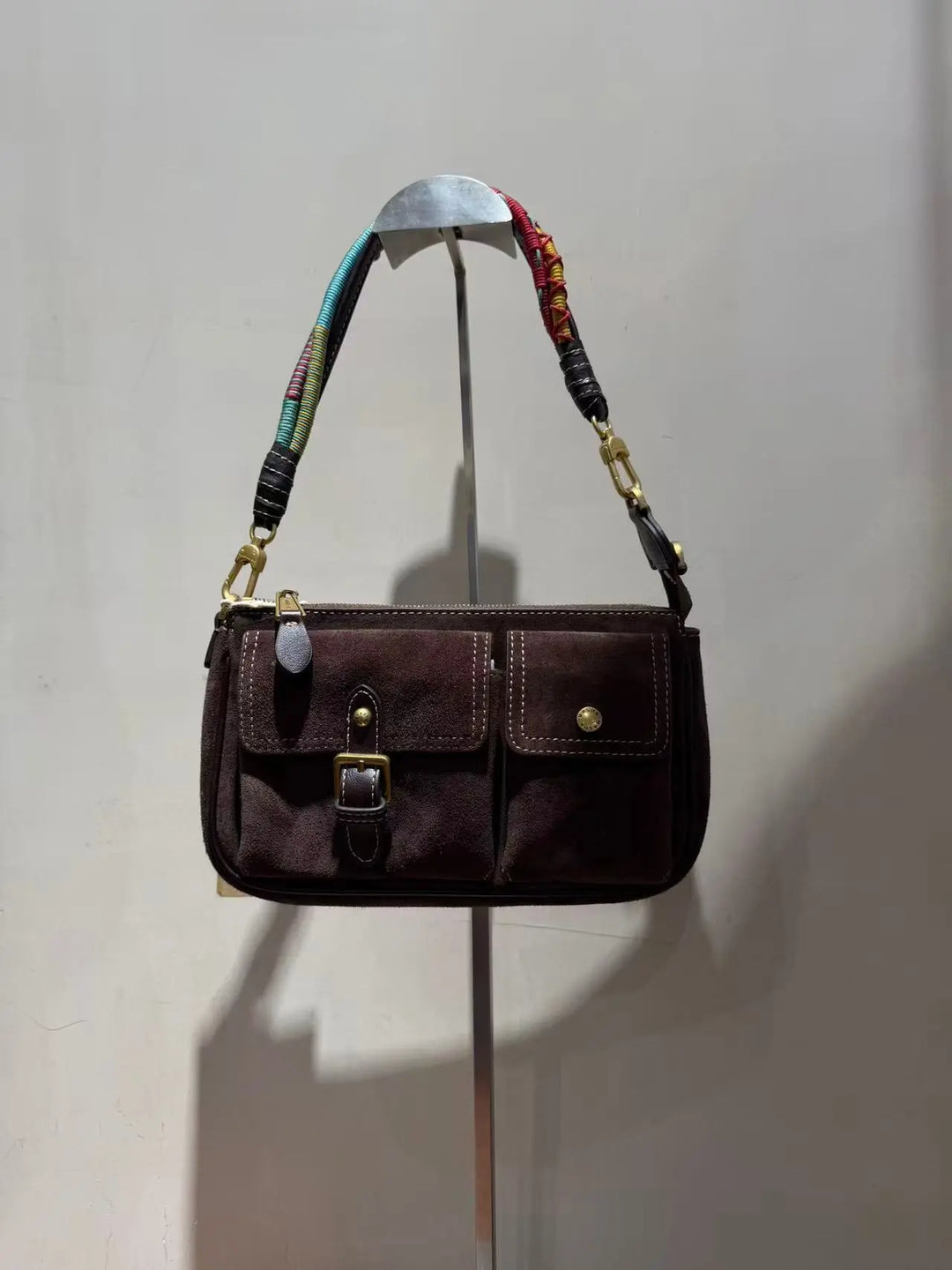 An image of a   TF7250 Buckle-Pocket Baguette Bag by  Mirra Masa