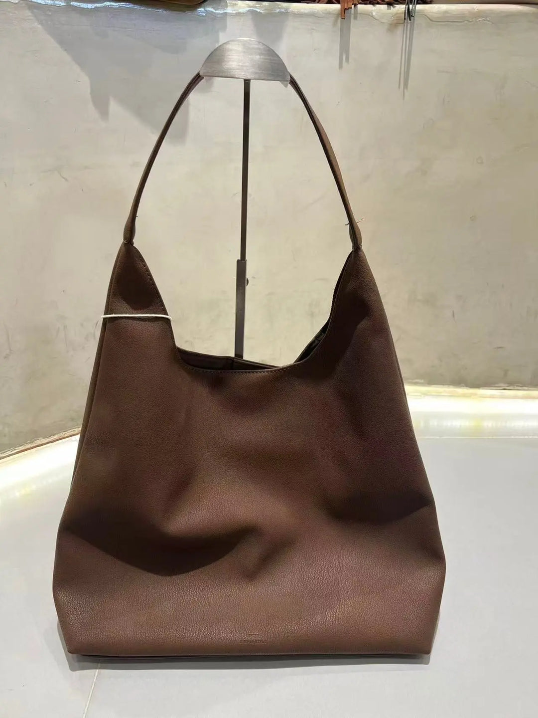An image of a  Brown TF9012 Suede Shoulder Bag by  Mirra Masa
