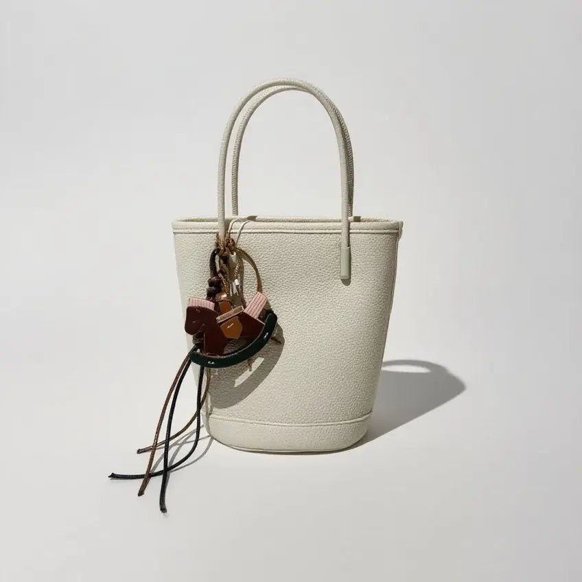 An image of a  Beige / Leather TF9699 Leather Bucket Handbag by  Mirra Masa