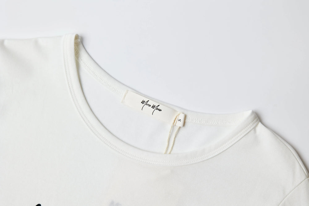 An image of a   TSA79M6 Graphic T-Shirt by  Mirra Masa