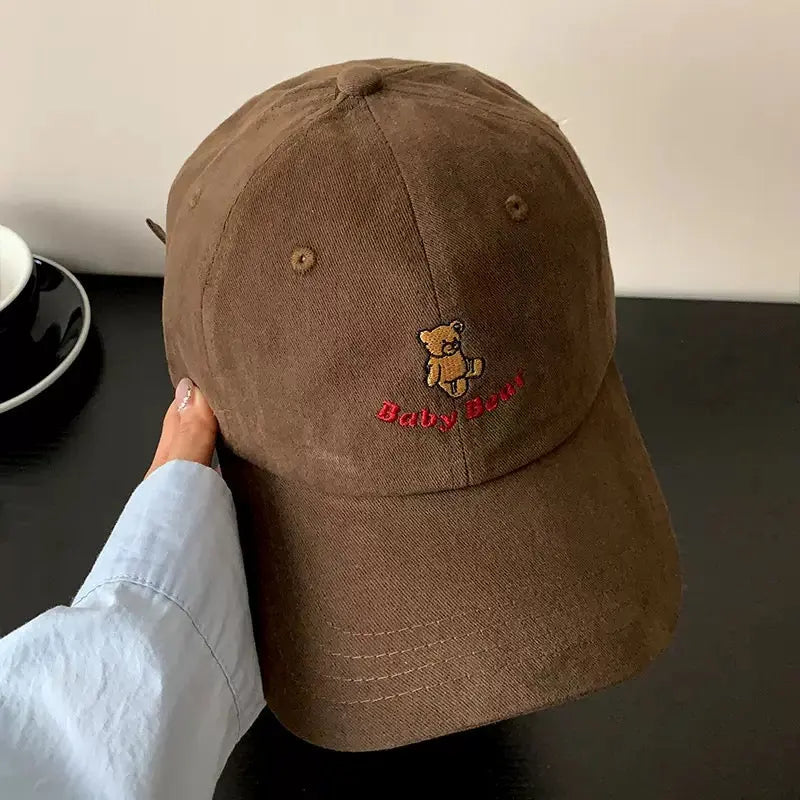 An image of a  Dark Brown Teddy Bear Embroidered Baseball Cap by  Mirra Masa