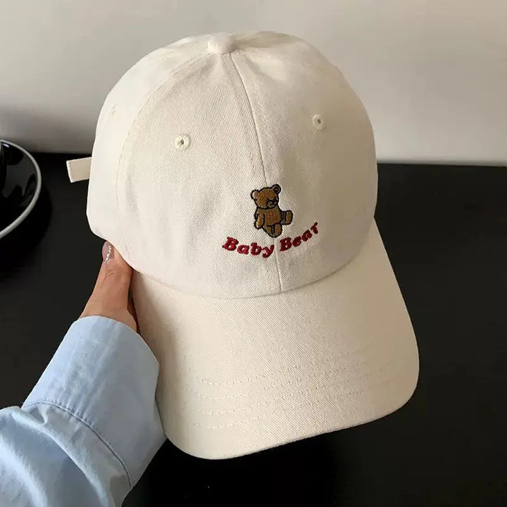 An image of a  Beige Teddy Bear Embroidered Baseball Cap by  Mirra Masa