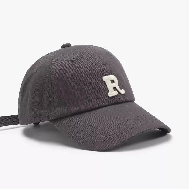An image of a  Grey Terry R Letter Baseball Cap by  Mirra Masa