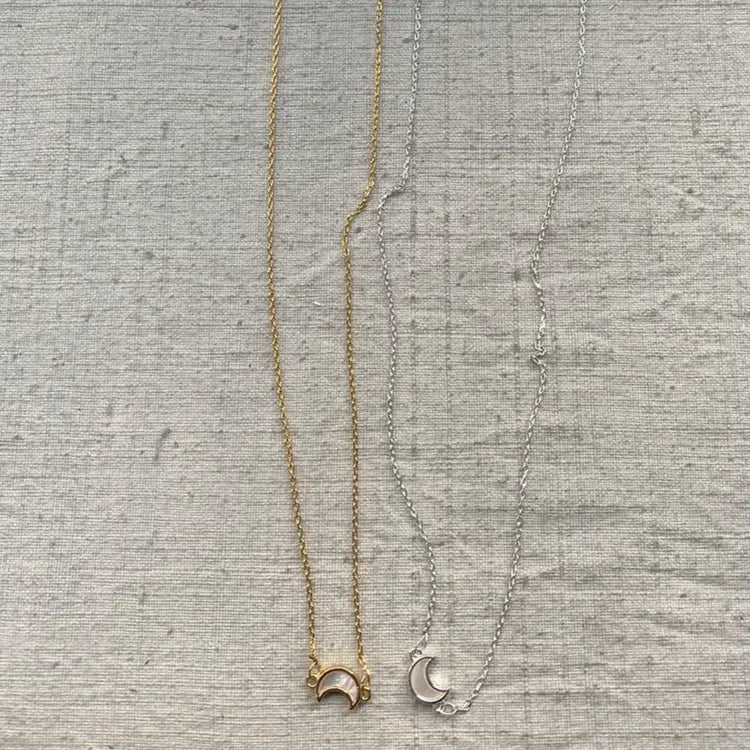 An image of a   The Pearlescent Moon Necklace Adjustable by  Mirra Masa