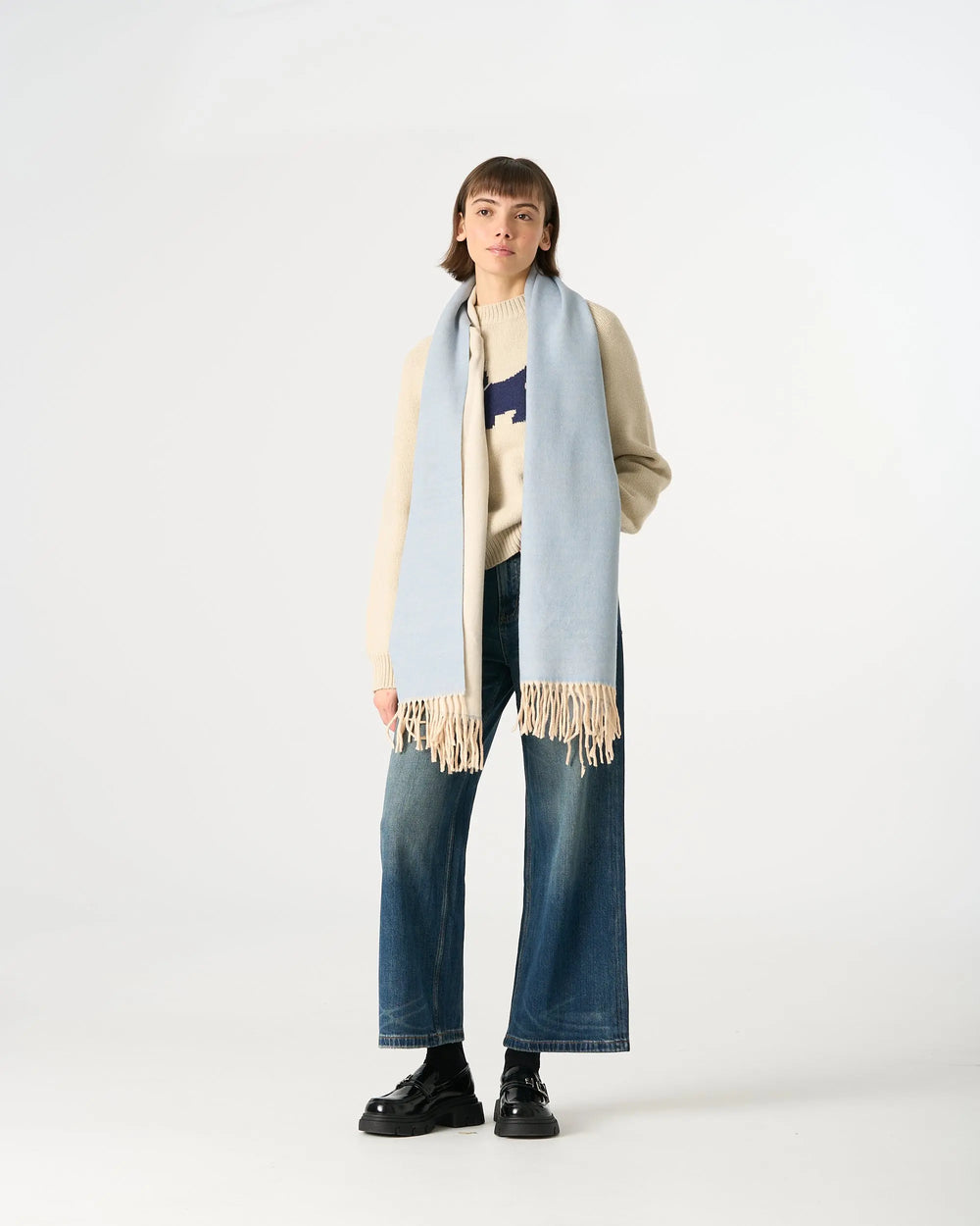 An image of a  Light Blue WJ28 Essential Checkered Scarf by  Mirra Masa