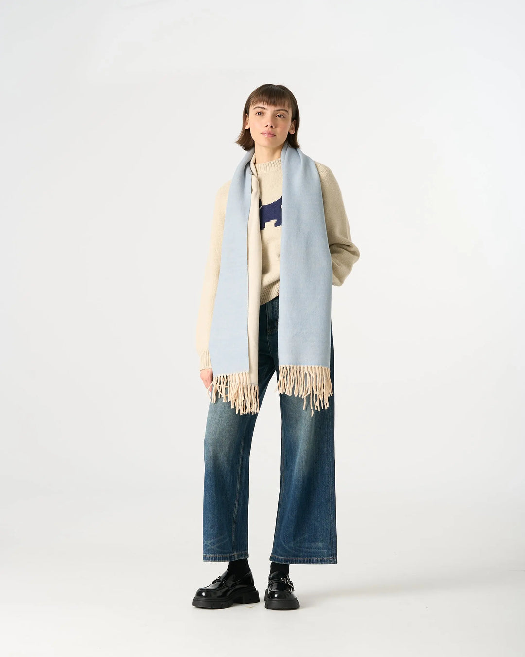 An image of a  Light Blue WJ28 Essential Checkered Scarf by  Mirra Masa