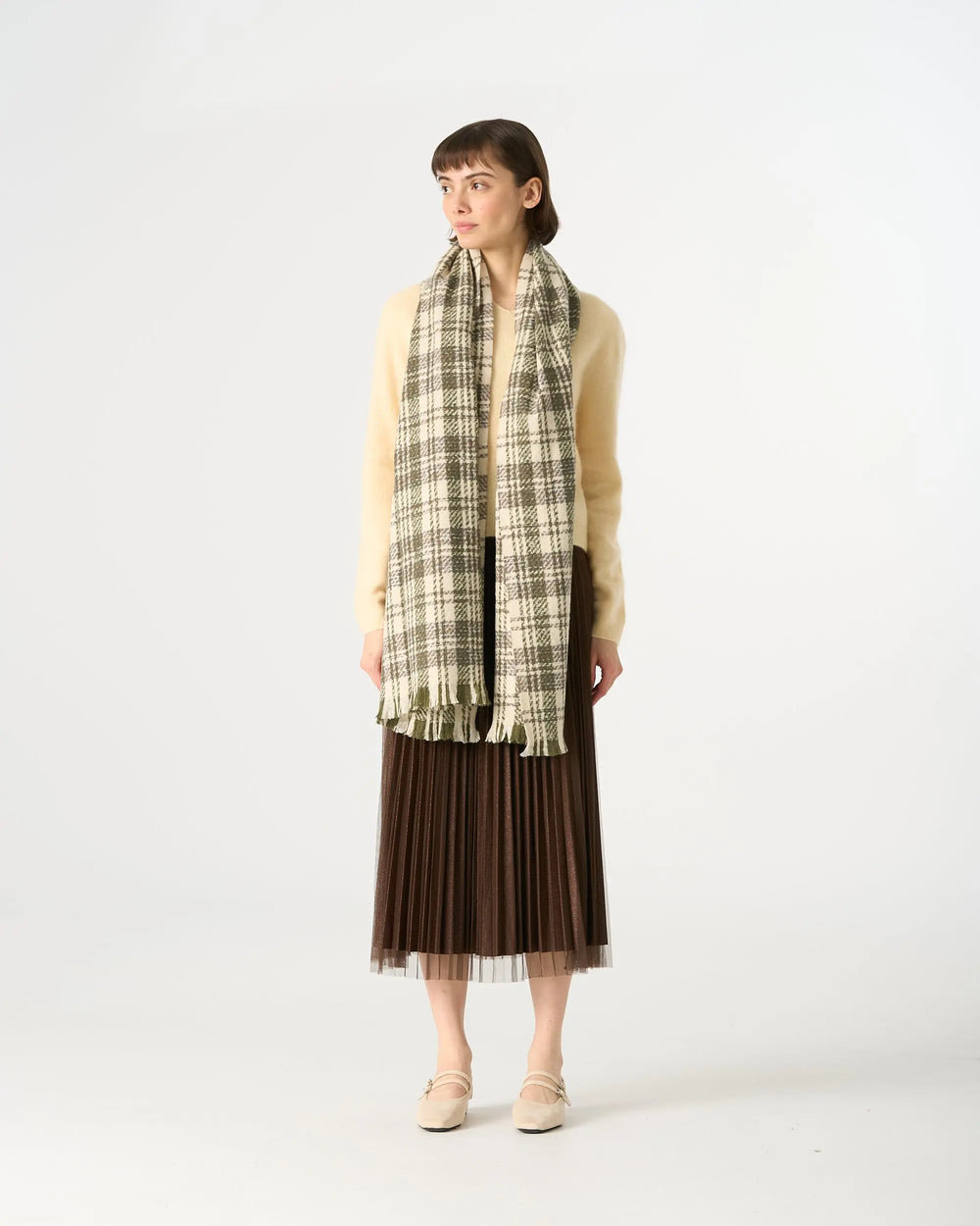 An image of a  Green Plaid WJ28 Essential Checkered Scarf by  Mirra Masa