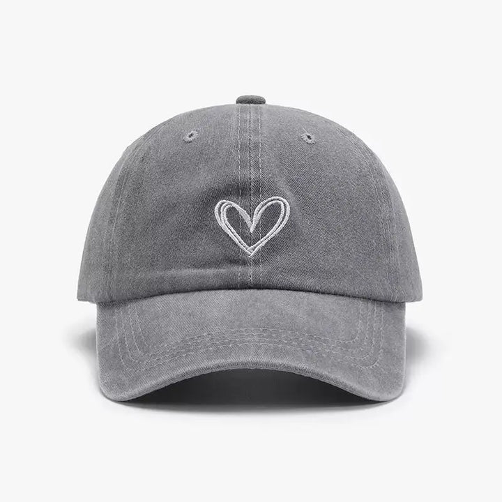 An image of a   Washed Heart Stitch Cap by  Mirra Masa